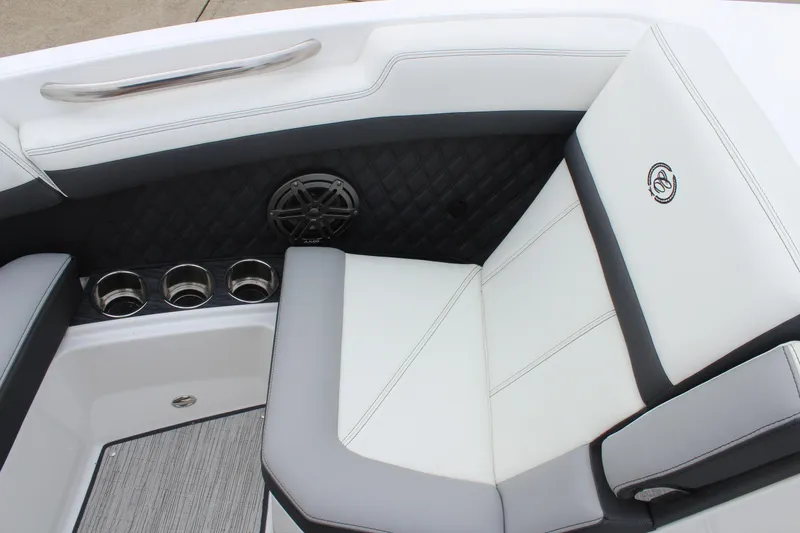 Slide: The Image of 2024 Cobalt R6 boat interior with cushioned seating and cup holders. - 30