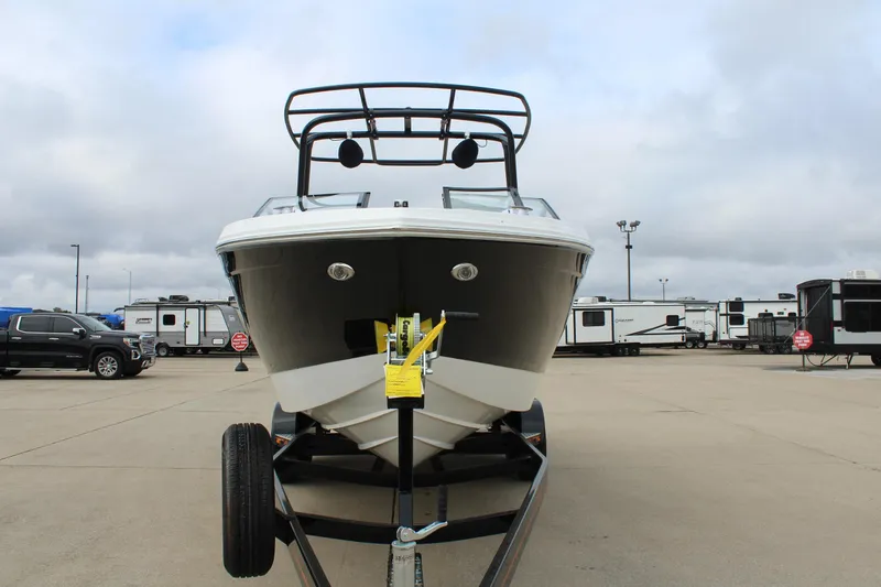 Slide: The Image of 2024 Cobalt R6 boat on trailer in parking lot, cloudy sky background. - 4