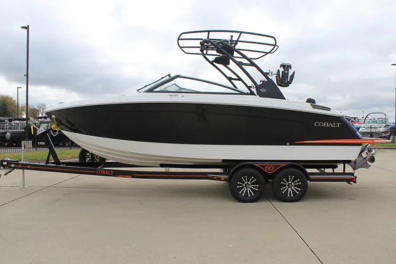 Slide: The Image of 2024 Cobalt R6 boat on trailer, sleek black and white design. - 6