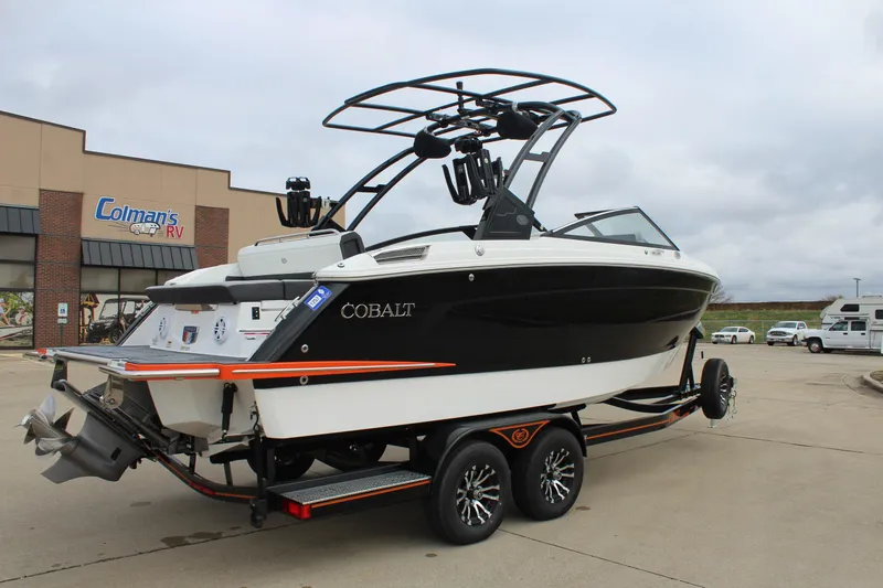 Slide: The Image of 2024 Cobalt R6 boat on trailer at dealership parking lot. - 8