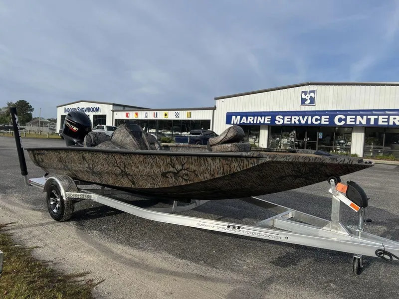 Slide: The Image of 2025 Xpress H18 Bass boat on trailer at Marine Service Center. - 5