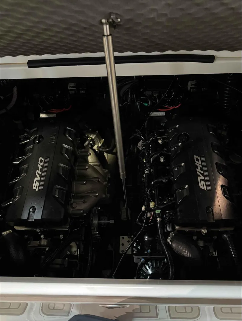 Slide: The Image of 2023 Yamaha Boats 255FSH SPORT E engine compartment with dual SVHO engines. - 13