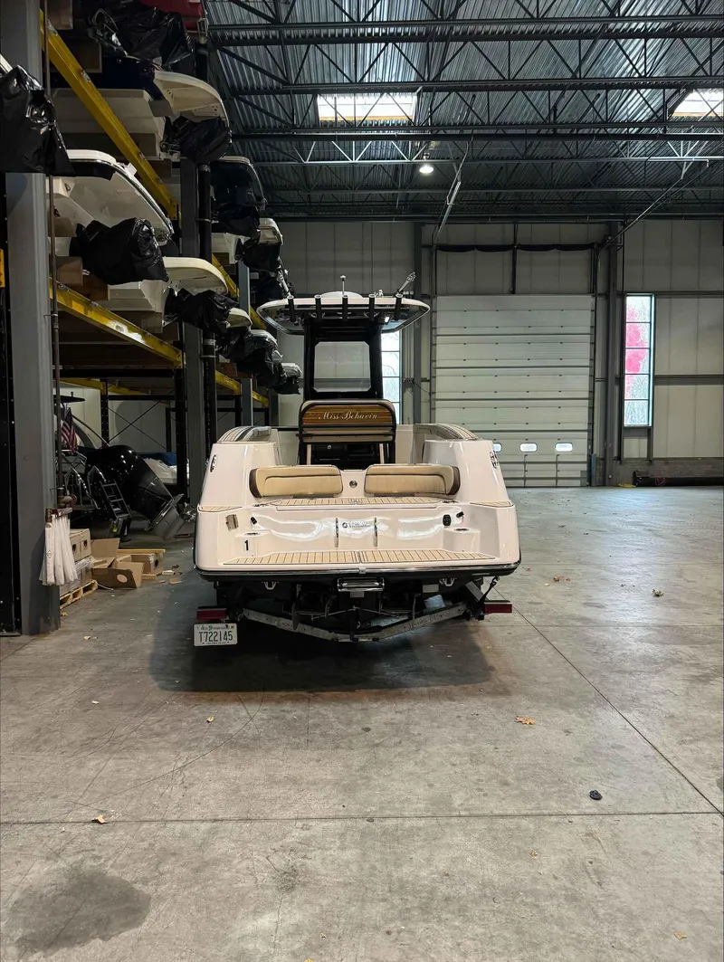 Slide: The Image of 2023 Yamaha Boats 255FSH SPORT E in warehouse, rear view. - 5