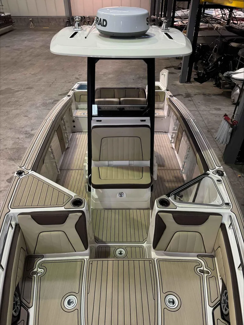 Slide: The Image of 2023 Yamaha Boats 255FSH SPORT E interior with seating and deck view. - 6
