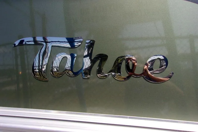 Slide: The Image of 2023 Tahoe Sport Bow 17 FT logo on metallic surface. - 14