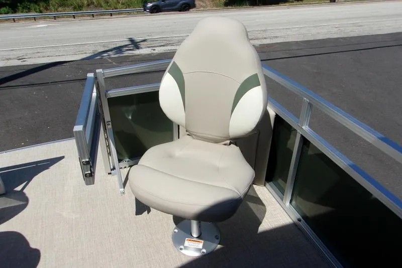 Slide: The Image of 2023 Tahoe Sport Bow 17 FT boat seat, beige and green, on deck. - 6
