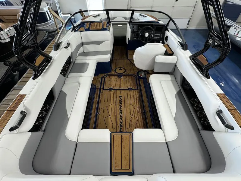Slide: The Image of 2025 Moomba Mojo boat interior with sleek seating and modern design. - 18