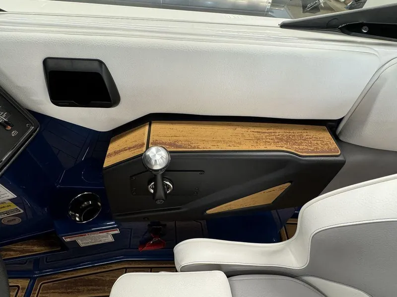 Slide: The Image of 2025 Moomba Mojo boat interior with sleek control panel and modern design. - 8