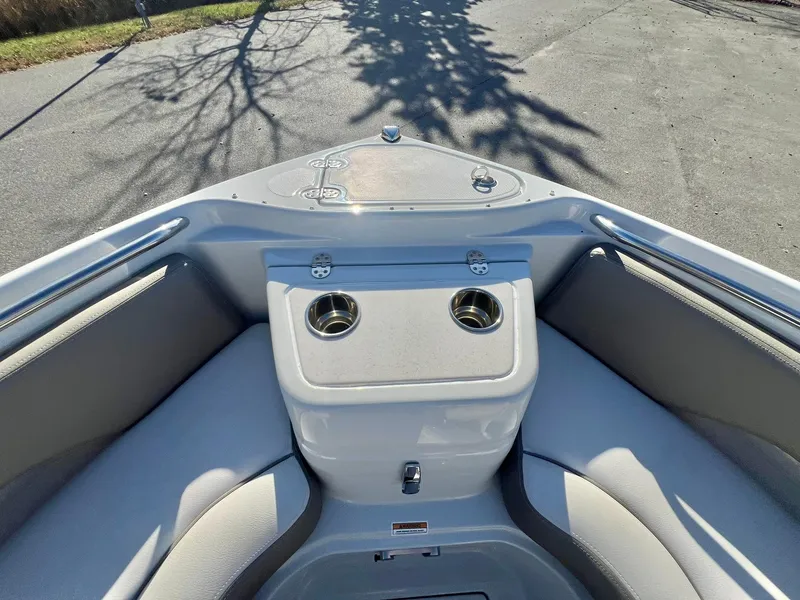 Slide: The Image of 2025 Crownline 280 DC boat interior with cup holders and seating. - 16