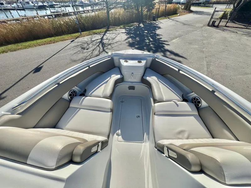 Slide: The Image of 2025 Crownline 280 DC boat interior with spacious seating and sleek design. - 19