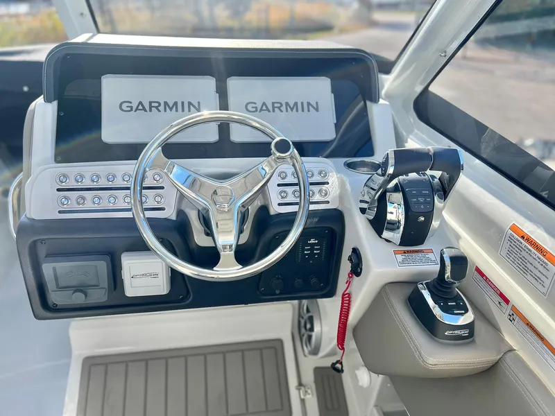 Slide: The Image of Crownline 280 DC 2025 dashboard with Garmin navigation and modern controls. - 27