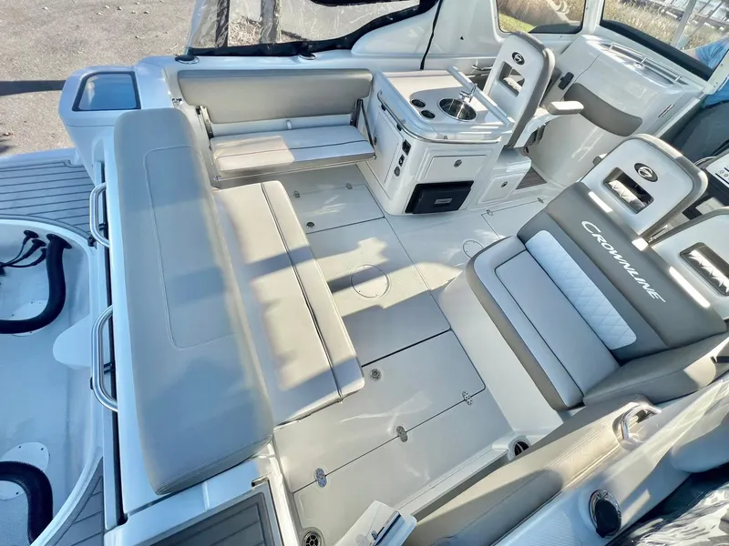 Slide: The Image of 2025 Crownline 280 DC boat interior with seating and helm station. - 36