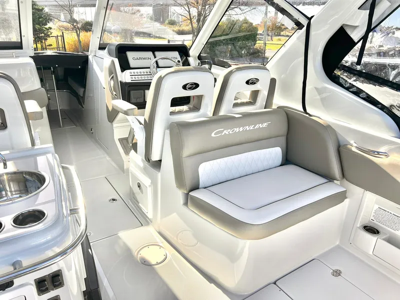 Slide: The Image of 2025 Crownline 280 DC boat interior with modern seating and navigation equipment. - 39