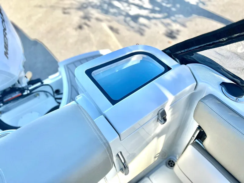 Slide: The Image of 2025 Crownline 280 DC boat interior with sleek white seating and modern design. - 43