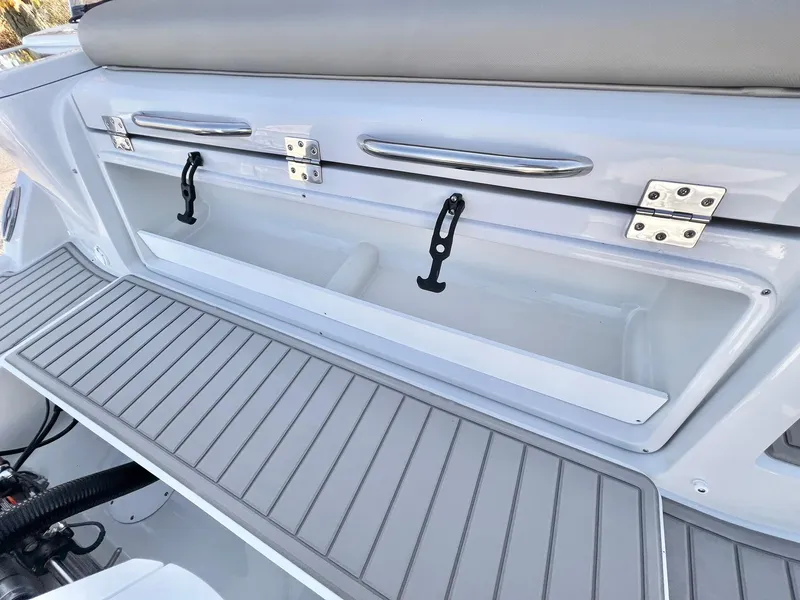 Slide: The Image of 2025 Crownline 280 DC boat storage compartment with sleek design and durable materials. - 5