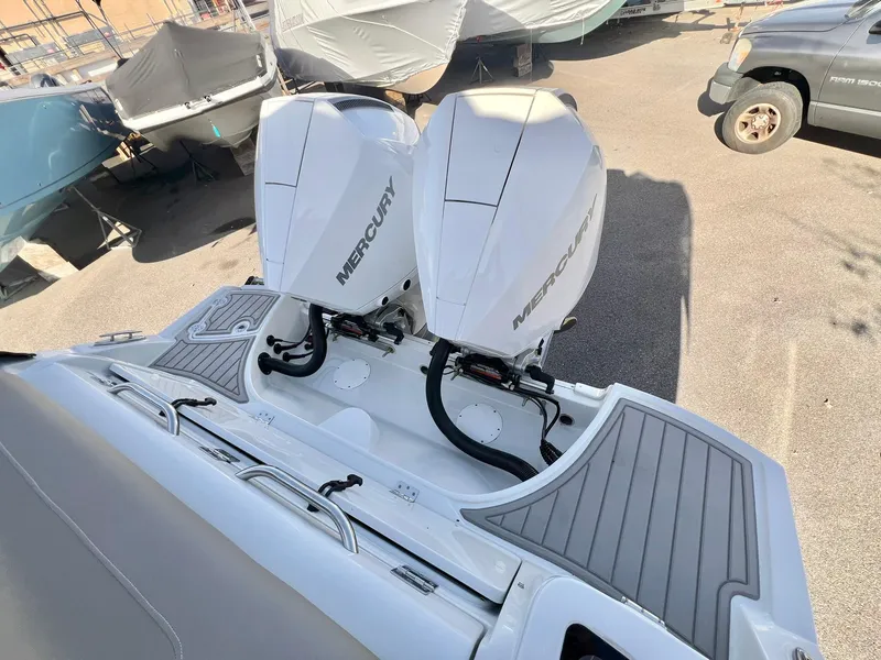 Slide: The Image of 2025 Crownline 280 DC boat with dual Mercury outboard engines. - 7