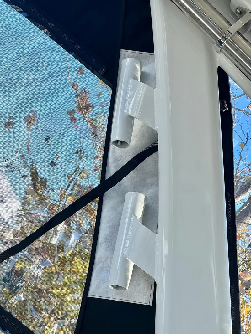 Slide: The Image of Crownline 280 DC 2025 boat interior detail with window and fittings. - 9