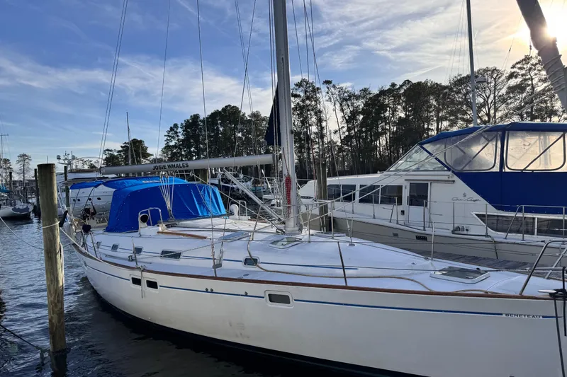 The Image of 1999 Beneteau Oceanis Clipper 461 sailboat docked at marina under clear sky. - 0