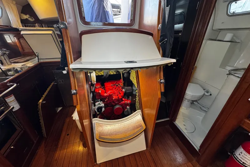 Slide: The Image of Engine compartment of 1999 Beneteau Oceanis Clipper 461 sailboat, showcasing interior layout. - 108