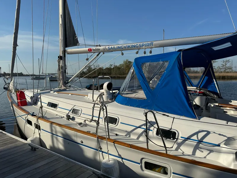 Slide: The Image of 1999 Beneteau Oceanis Clipper 461 sailboat docked at marina, side view. - 2
