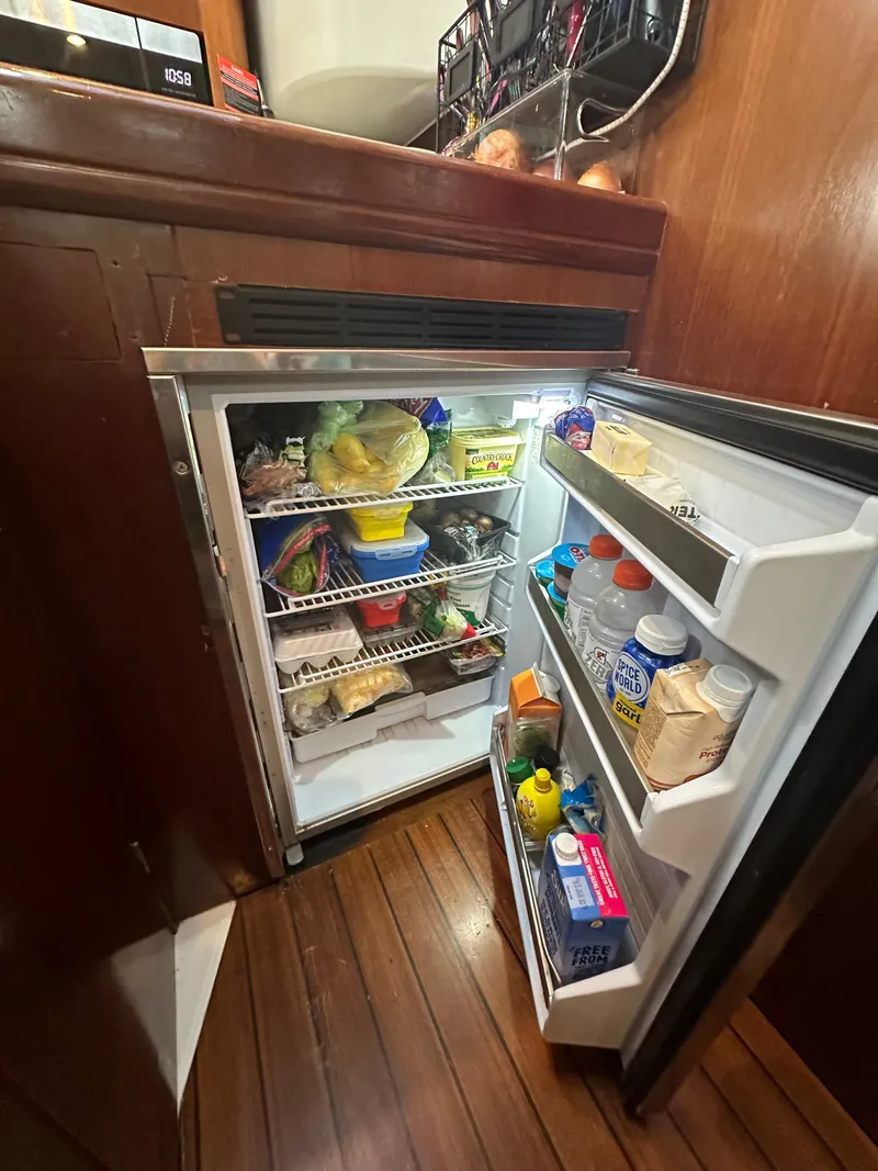 Slide: The Image of Beneteau Oceanis Clipper 461 with solar panels, 1999 model, under blue sky. - 26