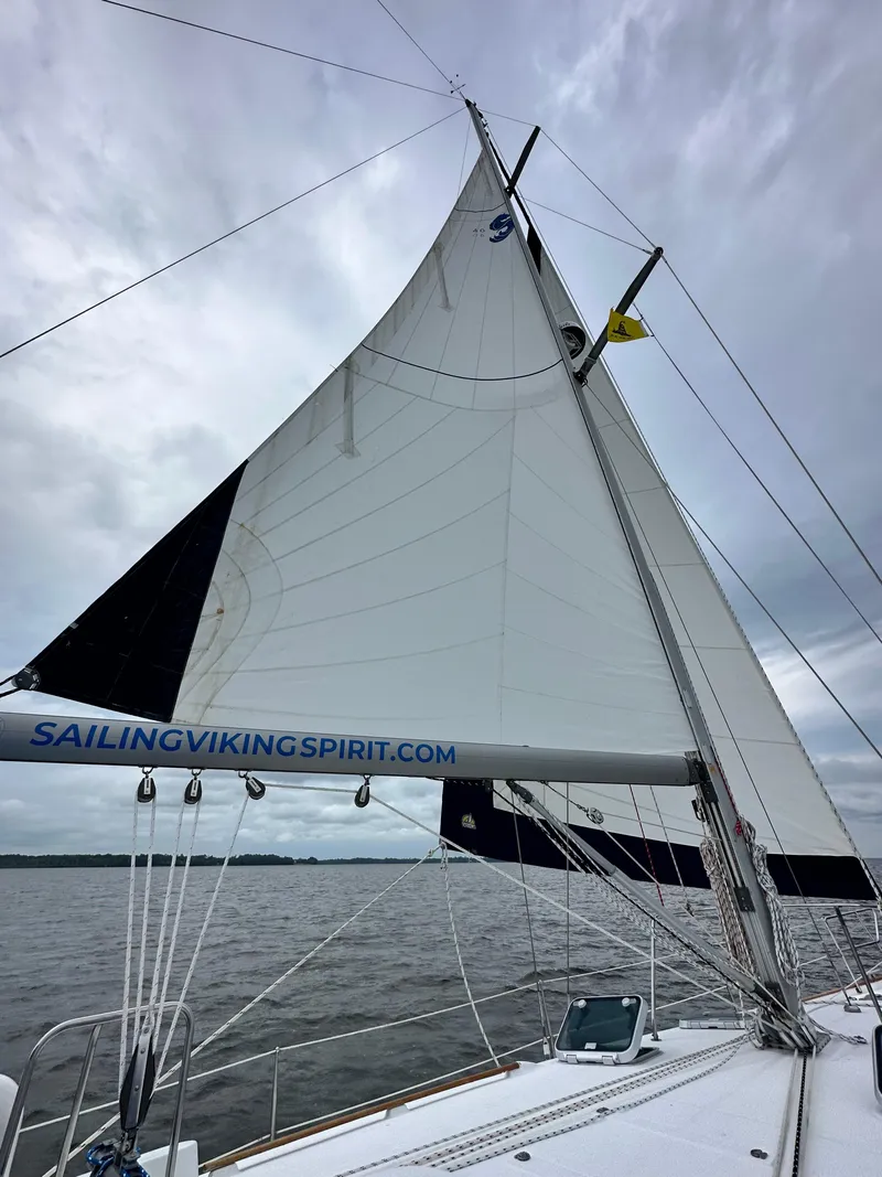 Slide: The Image of cockpit table fully extended. very comfortable seating for 4 around the table with room for more on either side. Cockpit cushions not shown but included - 59