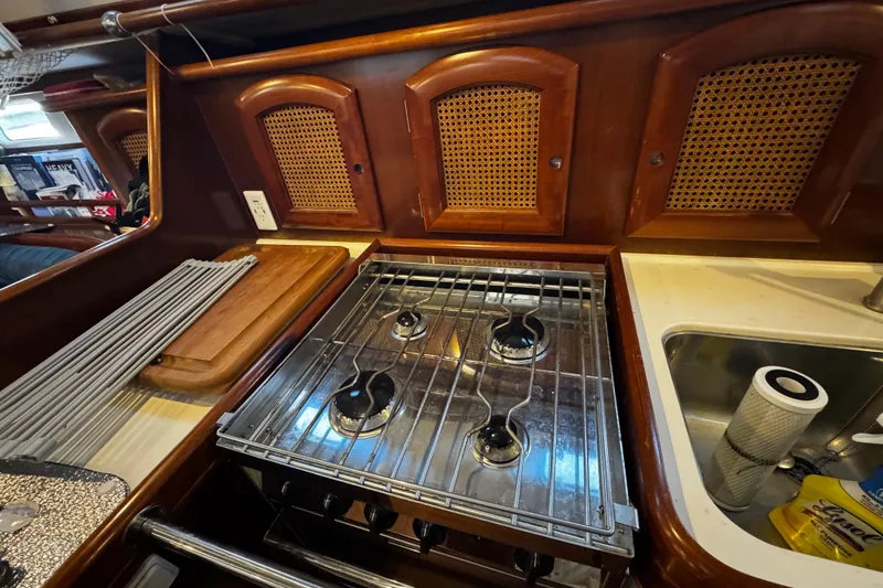 Slide: The Image of Galley kitchen in 1999 Beneteau Oceanis Clipper 461 sailboat with stove and sink. - 73