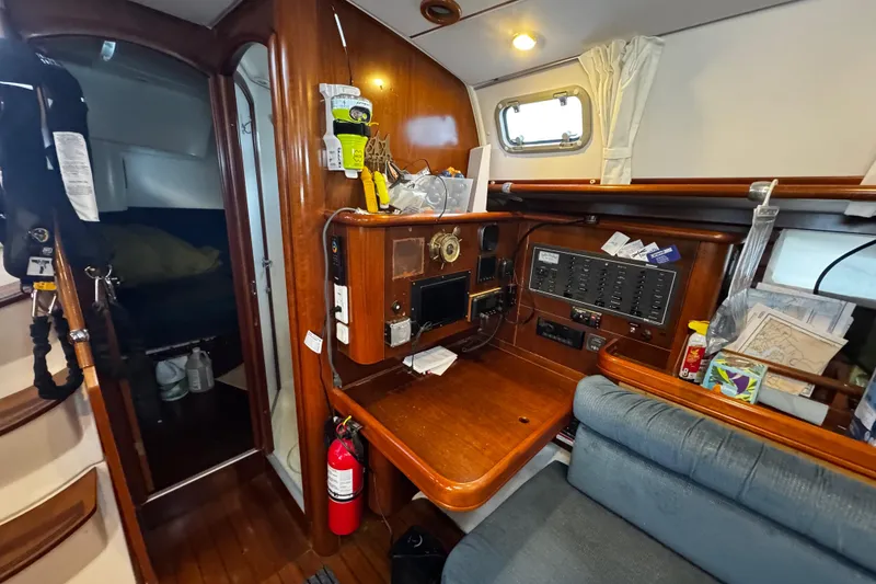 Slide: The Image of Interior of 1999 Beneteau Oceanis Clipper 461 yacht with from left , companionway, aft cabin, wet head and the nav station - 92