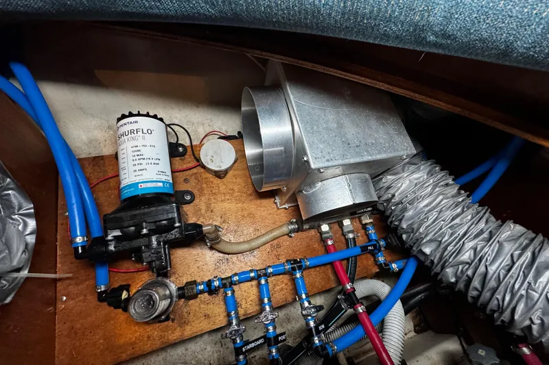 Slide: The Image of clearly marked new tubing for all the water tanks is under the salon dinette - 98