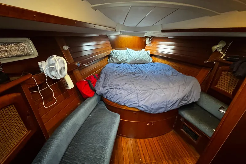 Slide: The Image of Cozy cabin interior of 1999 Beneteau Oceanis Clipper 461 sailboat with wooden finish. - 99