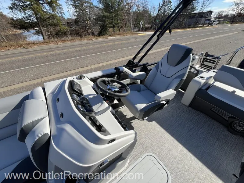 Slide: The Image of 2024 Avalon LSZ Versatile Rear Bench boat interior with modern helm and seating. - 15