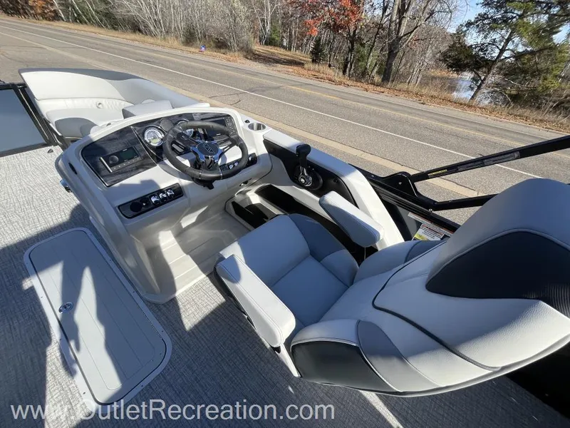 Slide: The Image of 2024 Avalon LSZ Versatile Rear Bench boat interior with modern dashboard and seating. - 22