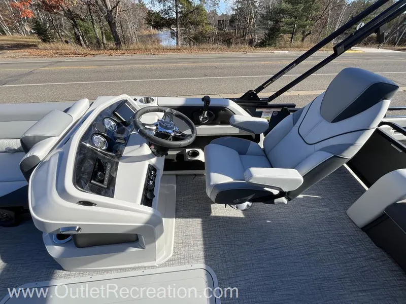 Slide: The Image of 2024 Avalon LSZ Versatile Rear Bench boat interior with modern helm and seating. - 26
