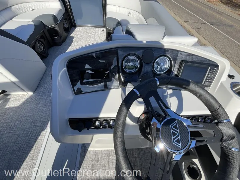 Slide: The Image of 2024 Avalon LSZ Versatile Rear Bench boat dashboard with steering wheel and controls. - 27