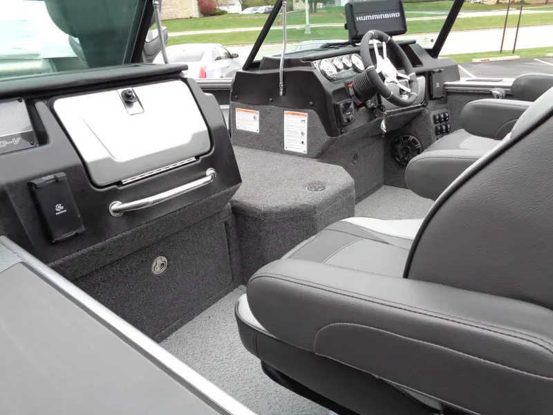 Slide: The Image of Interior of 2025 Lund 1975 Pro-V boat with modern dashboard and seating. - 11