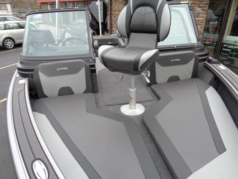 Slide: The Image of 2025 Lund 1975 Pro-V boat interior with sleek seating and modern design. - 13