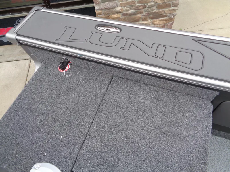 Slide: The Image of Lund 1975 Pro-V 2025 boat deck with logo and textured surface. - 17