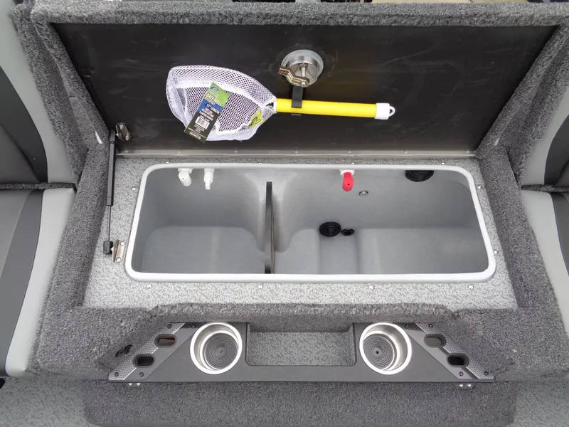 Slide: The Image of Open storage compartment in 2025 Lund 1975 Pro-V boat with fishing net and cup holders. - 20