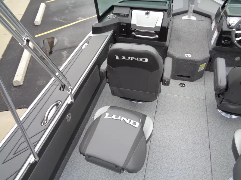 Slide: The Image of Interior of 2025 Lund 1975 Pro-V boat with branded seating and modern design. - 22