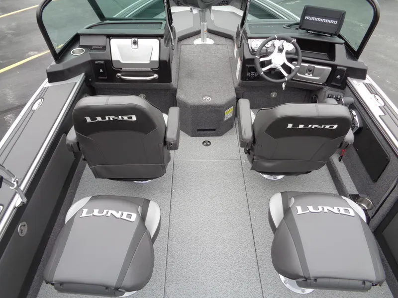 Slide: The Image of Interior of 2025 Lund 1975 Pro-V boat with four seats and modern dashboard. - 24