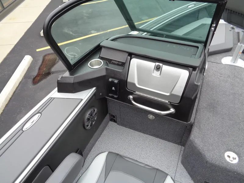 Slide: The Image of Interior of 2025 Lund 1975 Pro-V boat, featuring modern dashboard and seating. - 25