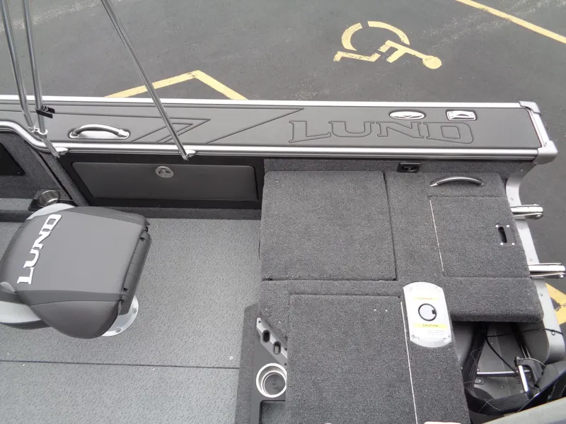 Slide: The Image of Interior of 2025 Lund 1975 Pro-V boat with seating and storage compartments. - 32