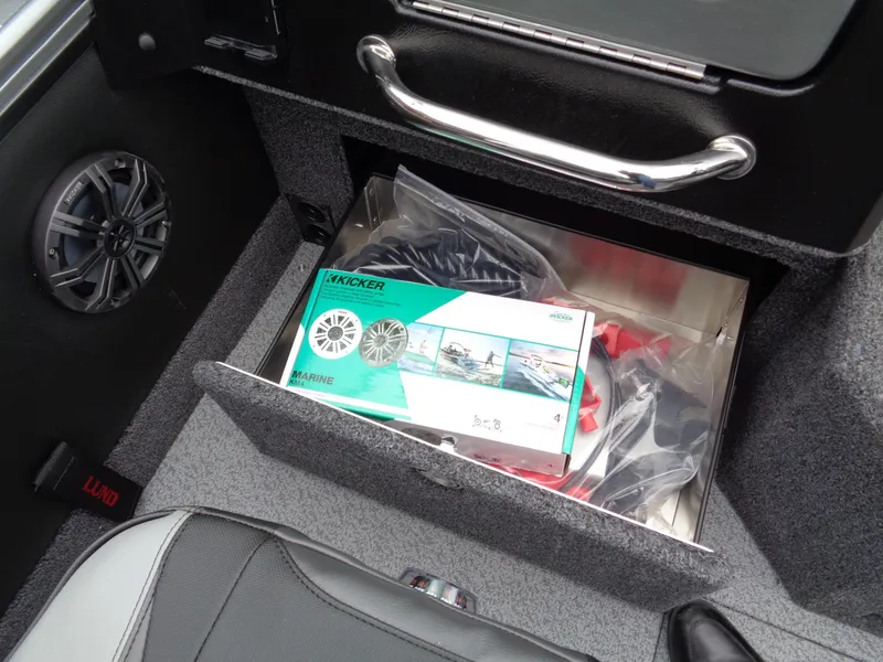 Slide: The Image of Storage compartment in 2025 Lund 1975 Pro-V boat with Kicker marine speakers. - 34
