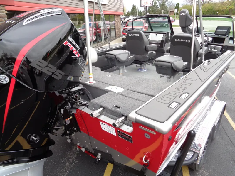 Slide: The Image of 2025 Lund 1975 Pro-V boat with powerful outboard motor and spacious seating. - 35