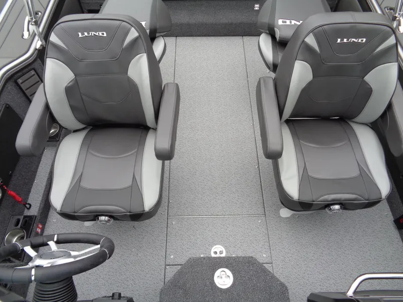 Slide: The Image of Interior of 2025 Lund 1975 Pro-V boat with gray and black seating. - 37