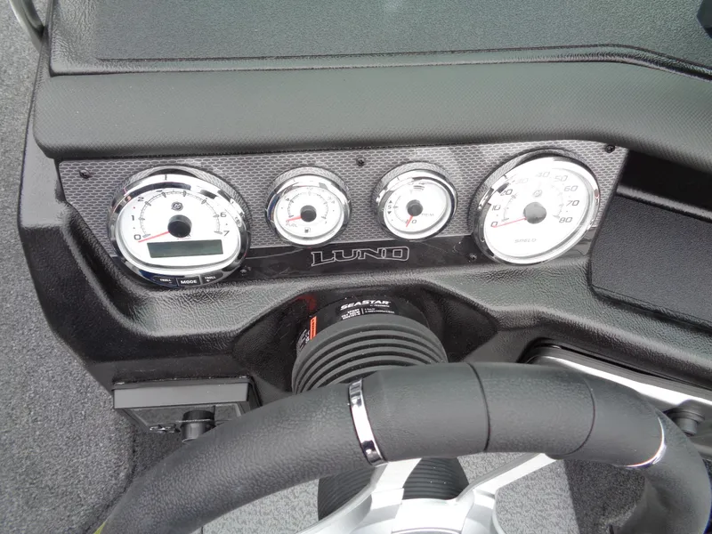 Slide: The Image of Dashboard of 2025 Lund 1975 Pro-V boat with gauges and steering wheel. - 39