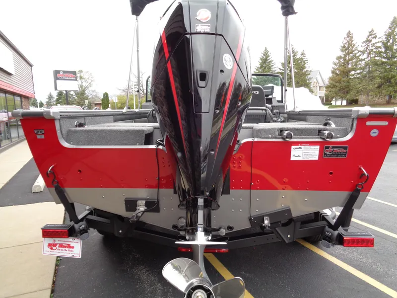 Slide: The Image of Red and black 2025 Lund 1975 Pro-V boat with powerful outboard motor. - 41