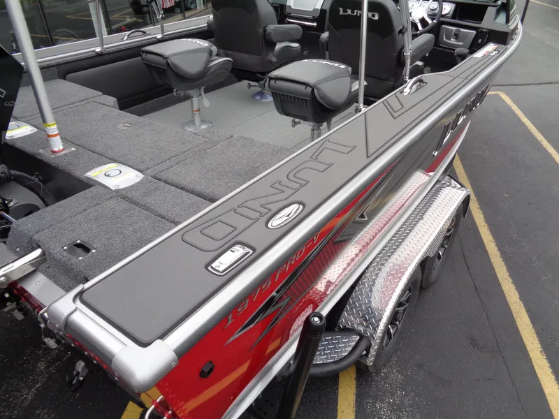 Slide: The Image of 2025 Lund 1975 Pro-V boat interior with seating and storage compartments. - 43