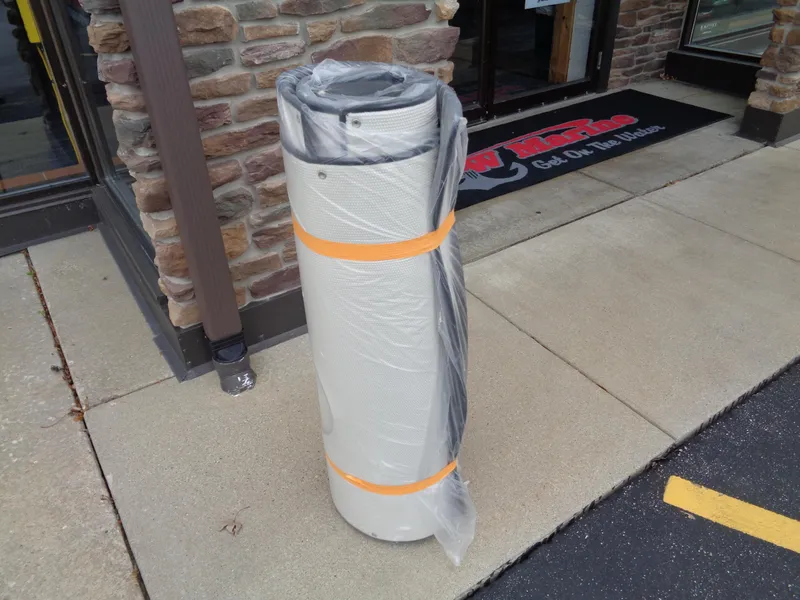 Slide: The Image of Rolled boat cover for Lund 1975 Pro-V, 2025 model, wrapped in plastic. - 44