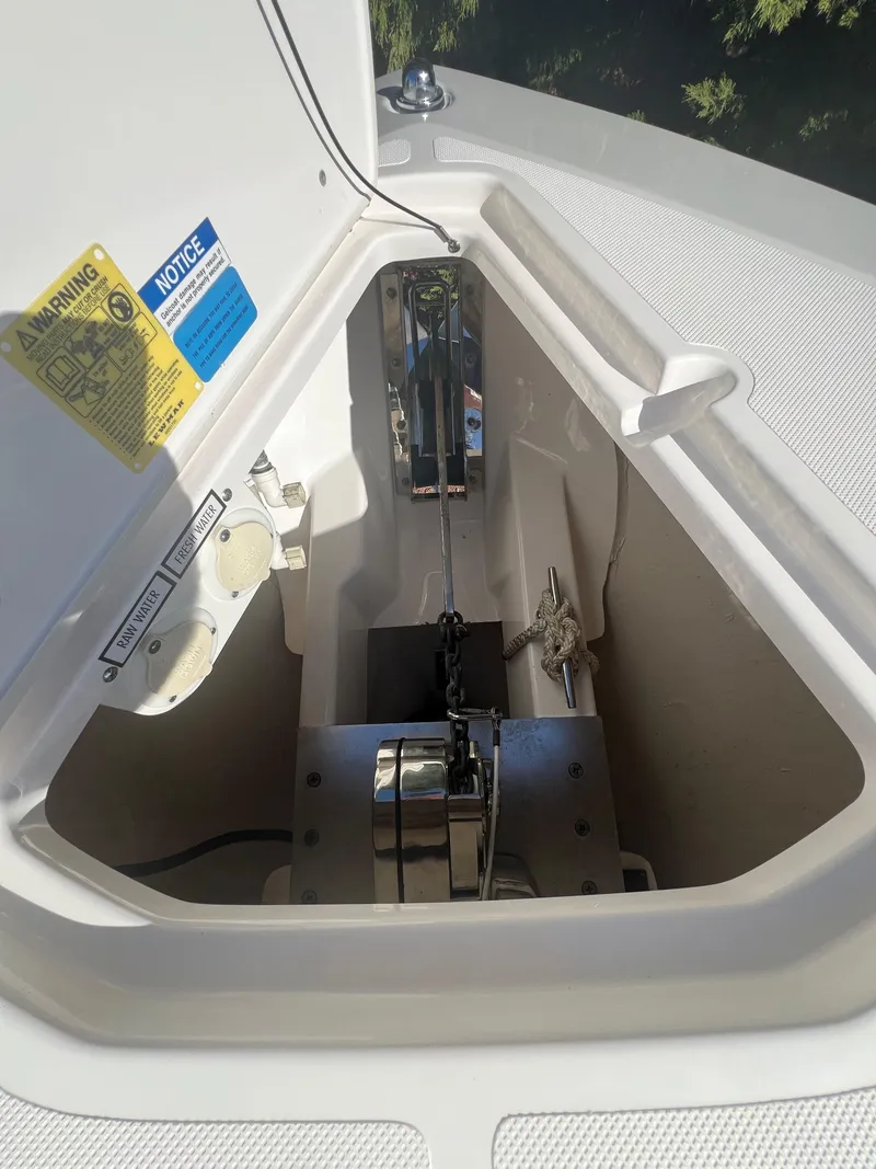 Slide: The Image of Anchor compartment of 2017 Pursuit 325 DC Dual Console boat. - 37